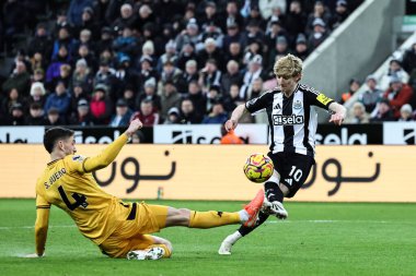 Wolverhampton Wanderers 'dan Santiago Bueno, Premier League maçı Newcastle United' a karşı Wolverhampton Wanderers maçında İngiltere 'nin Newcastle şehrinde 15 Ocak 2025' te oynanan karşılaşmada Newcastle United 'dan Anthony Gordon' ın attığı şutu engelledi.