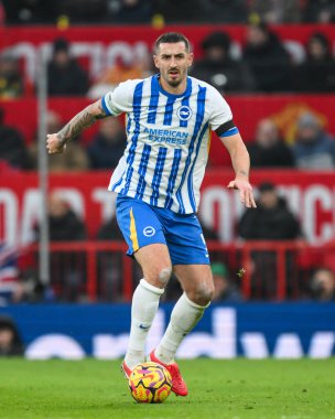 Lewis Dunk of Brighton & Hove Albion makes a break with the ball during the Premier League match Manchester United vs Brighton and Hove Albion at Old Trafford, Manchester, United Kingdom, 19th January 2025 clipart