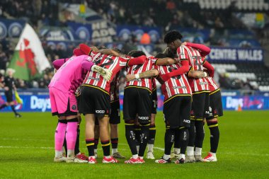 Sheffield United oyuncuları, Swansea.com Stadyumu, Swansea.com, İngiltere 'de 21 Ocak 2025 tarihinde oynanan Swansea City - Sheffield United karşılaşması öncesinde bir araya geldiler.