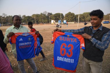 Supporters of the Indian cricket team with team india captain Surya printed jerssy  their way to the Eden Gardens Cricket Stadium for the  first Twenty20 match between India and England at Eden Gardens on January 22, 2025 in Kolkata, India. clipart