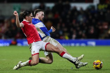 George Dobson of Wrexham and Marc Leonard of Birmingham City battle for the ball during the Sky Bet League 1 match Wrexham vs Birmingham City at SToK Cae Ras, Wrexham, United Kingdom, 23rd January 2025 clipart