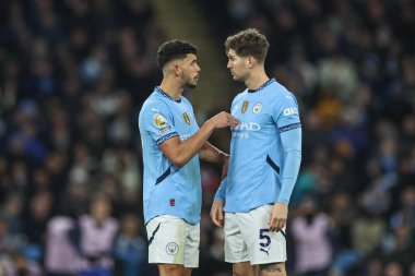 Manchester City 'den Matheus Nunes, Manchester City - Chelsea maçında Manchester City maçında 25 Ocak 2025' te İngiltere 'nin Etihad Stadyumu' nda Manchester City 'den John Stones ile konuştu.