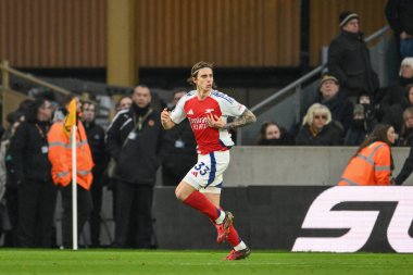 Arsenal 'den Riccardo Calafiori, 25 Ocak 2025' te Molineux, Wolverhampton, Birleşik Krallık 'ta oynanan Premier League maçında Wolverhampton Wanderers-Arsenal maçında 0-1 kazanma hedefini kutluyor.