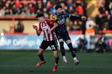 Exeter City 'den Joel Colwill ve Blackpool' dan James Husband, 25 Ocak 2025 'te St James' Park 'ta oynanan Sky Bet 1 karşılaşmasında top için mücadele ettiler.
