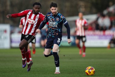 Blackpool 'dan James Husband, Sky Bet 1 karşılaşmasında pas veriyor. Exeter City, St. James' Park, Exeter, İngiltere 'de 25 Ocak 2025' te Blackpool 'a karşı.