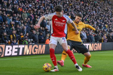 Arsenal 'den Declan Rice ve Wolverhampton Wanderers takımından Matt Doherty, 25 Ocak 2025' te Molineux, Wolverhampton, Birleşik Krallık 'ta oynanan Premier League maçında Wolverhampton Wanderers ve Arsenal maçında top için mücadele ettiler.