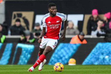 Thomas Partey of Arsenal makes a break with the ball during the Premier League match Wolverhampton Wanderers vs Arsenal at Molineux, Wolverhampton, United Kingdom, 25th January 2025 clipart