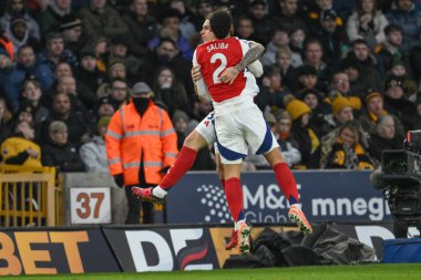 Arsenal 'den Riccardo Calafiori, 25 Ocak 2025' te Molineux, Wolverhampton, Birleşik Krallık 'ta oynanan Premier League maçında Wolverhampton Wanderers-Arsenal maçında 0-1 kazanma hedefini kutluyor.