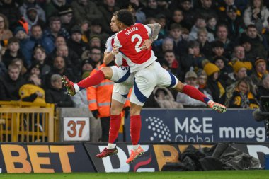 Arsenal 'den Riccardo Calafiori, 25 Ocak 2025' te Molineux, Wolverhampton, Birleşik Krallık 'ta oynanan Premier League maçında Wolverhampton Wanderers-Arsenal maçında 0-1 kazanma hedefini kutluyor.