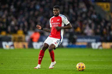 Arsenal 'den Thomas Partey Premier Lig maçı sırasında Wolverhampton Wanderers ile Molineux, Wolverhampton, Birleşik Krallık' ta 25 Ocak 2025 'te oynanan Arsenal maçında topla hareket halinde.