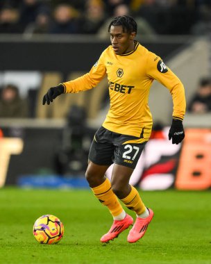 Wolverhampton Wanderers takımından Jean-Ricner Bellegarde, Premier League maçında Wolverhampton Wanderers 'a karşı Molineux, Wolverhampton, Birleşik Krallık' ta 25 Ocak 2025 'te oynanan maçta topu aldı.