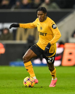 Wolverhampton Wanderers takımından Jean-Ricner Bellegarde, Premier League maçında Wolverhampton Wanderers 'a karşı Molineux, Wolverhampton, Birleşik Krallık' ta 25 Ocak 2025 'te oynanan maçta topu aldı.