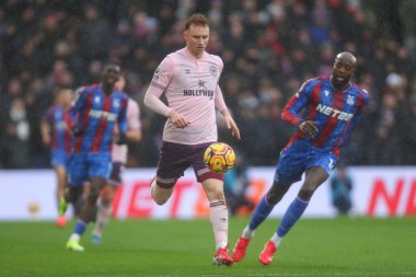 Sepp van den Berg of Brentford chases the ball during the Premier League match Crystal Palace vs Brentford at Selhurst Park, London, United Kingdom, 26th January 2025 clipart