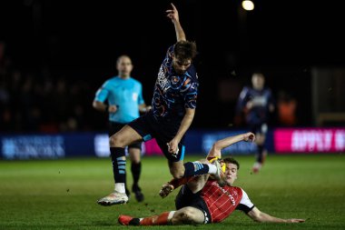 Blackpool 'dan Tom Bloxham ve Lincoln City' den Conor McGrandles 28 Ocak 2025 'te Gelder Group Sincil Bank Stadyumu' nda oynanan 1.
