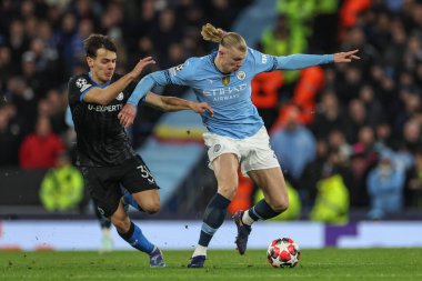 Erling Haaland of Manchester City and Ardon Jashari of Club Brugge battle for the ball during the UEFA Champions League Matchday 8 of 8 Manchester City vs Club Brugge at Etihad Stadium, Manchester, United Kingdom, 29th January 2025 clipart