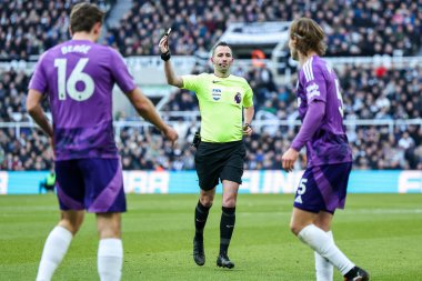 Referee Chris Kavanagh shows a yellow card to Joachim Andersen of Fulham during the Premier League match Newcastle United vs Fulham at St. James's Park, Newcastle, United Kingdom, 1st February 2025 clipart