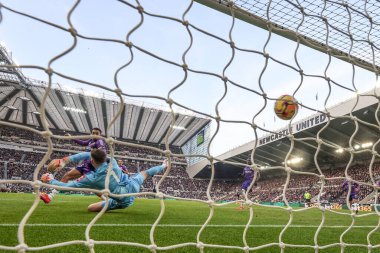 Jacob Murphy of Newcastle United scores pass Bernd Leno of Fulham to make it 1-0 during the Premier League match Newcastle United vs Fulham at St. James's Park, Newcastle, United Kingdom, 1st February 2025 clipart