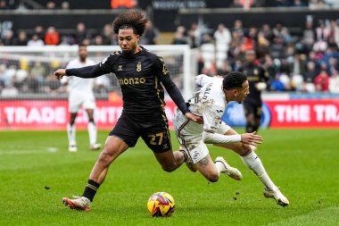 Coventry City 'den Milan van Ewijk, 1 Şubat 2025' te İngiltere 'nin Swansea.com Stadyumu' nda oynanan Sky Bet Şampiyonası karşılaşmasında Swansea City ile Coventry City arasındaki maçta Swansea City 'li Ronald' i yere serdi.