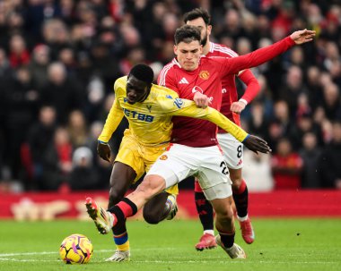 Manuel Ugarte of Manchester United fouls Ismala Sarr of Crystal Palace during the Premier League match Manchester United vs Crystal Palace at Old Trafford, Manchester, United Kingdom, 2nd February 2025 clipart