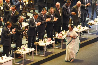 Reliance Industries Chairperson Mukesh Ambani (L)  with Amit Mitra,Industrialist Sajjan Jindal,Sanjeev Goenka , West Bengal Chief Minister Mamata Banerjee (R) during the inaugural session of the Bengal Global Business Summit-2025 in Kolkata, India clipart