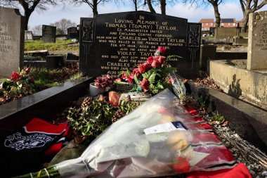 A general view of former Barnsley FC and Manchester United and England international forward Tommy Taylor grave and headstone 67 years after 23 passengers 8 of whom were Manchester United players sadly lost their lives in the Munich Air disaster  clipart