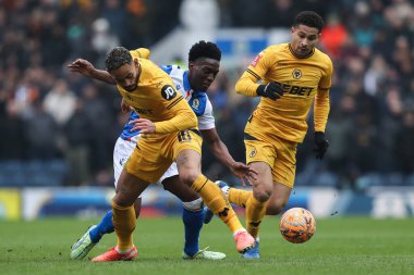 Amario Cozier-Duberry of Blackburn Rovers skips past Matheus Cunha of Wolverhampton Wanderers during the Emirates FA Cup Fourth Round Blackburn Rovers vs Wolverhampton Wanderers at Ewood Park, Blackburn, United Kingdom, 9th February 2025 clipart