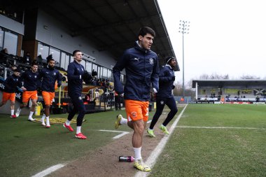 Blackpool 'dan Rob Apter, 8 Şubat 2025' te İngiltere 'nin Trent kentindeki Pirelli Stadyumu' nda oynanan Sky Bet 1 karşılaşması öncesinde oynanan maç öncesi ısınma maçında Burton Albion ile Blackpool karşı karşıya geldi.