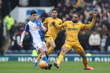 John Buckley of Blackburn Rovers and Matheus Cunha of Wolverhampton Wanderers battle for the ball during the Emirates FA Cup Fourth Round Blackburn Rovers vs Wolverhampton Wanderers at Ewood Park, Blackburn, United Kingdom, 9th February 2025 clipart