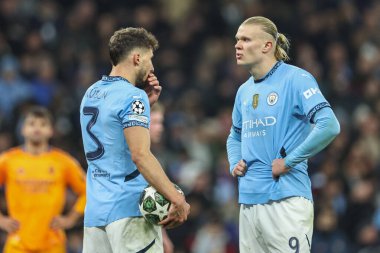 Rben Dias of Manchester City and Erling Haaland of Manchester City discuss the penalty during the UEFA Champions League Knockout Round Play-off Manchester City v Real Madrid at Etihad Stadium, Manchester, United Kingdom, 11th February 2025 clipart