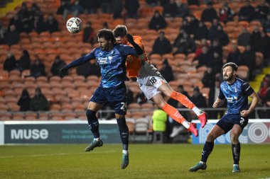 Jake Beesley of Blackpool and Cameron Humphreys of Rotherham United battle for the ball during the Sky Bet League 1 match Blackpool vs Rotherham United at Bloomfield Road, Blackpool, United Kingdom, 11th February 2025 clipart