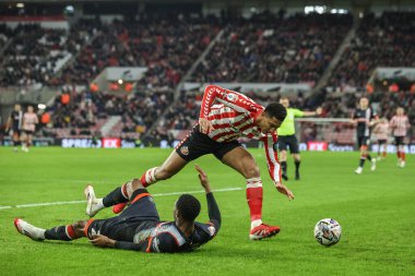 Luton Town 'dan Lamine Fanne, 12 Şubat 2025' te İngiltere 'nin Sunderland şehrinde Luton Town' a karşı oynanan Gökyüzü İddia Şampiyonası karşılaşmasında Sunderland 'lı Jobe Bellingham tarafından faul yaptı.