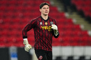 Sheffield United takımından Michael Cooper, 12 Şubat 2025 'te Sheffield Lane, İngiltere' de Sheffield United ile Middlesbrough maçından önce ısınıyor.