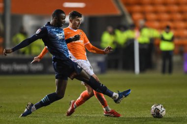 Albie Morgan of Blackpool and Hakeem Odoffin of Rotherham United battle for the ball during the Sky Bet League 1 match Blackpool vs Rotherham United at Bloomfield Road, Blackpool, United Kingdom, 11th February 2025 clipart