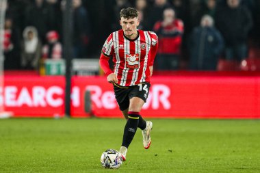 Sheffield United takımından Harrison Burrows, Sheffield Lane, İngiltere 'de 12 Şubat 2025 tarihinde oynanan ve Sheffield United' ın Middlesbrough 'a karşı oynadığı maçta topla koşuyor.