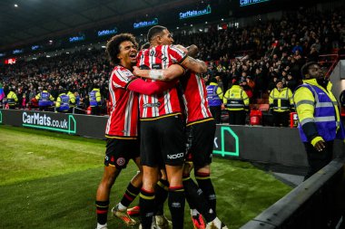 Sheffield United takımından Anel Ahmedhodziç, Sheffield Lane, Sheffield, İngiltere 'de 12 Şubat 2025' te oynanan Sky Bet Şampiyonası maçında takım arkadaşlarıyla yaptığı maçı 3-1 kazanarak kutluyor.