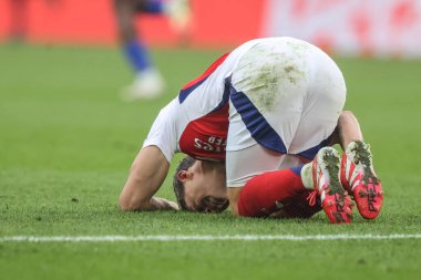 Leandro Trossard of Arsenal goes down with an injury during the Premier League match Leicester City vs Arsenal at King Power Stadium, Leicester, United Kingdom, 15th February 2025 clipart