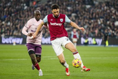 Maximilian Kilman of West Ham United is put under pressure by Yoane Wissa of Brentford during the Premier League match West Ham United vs Brentford at London Stadium, London, United Kingdom, 15th February 2025 clipart