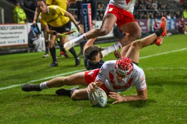 Harry Robertson of St. Helens goes over for a try during the Betfred Super League Round 1 match St Helens vs Salford Red Devils at Totally Wicked Stadium, St Helens, United Kingdom, 15th February 2025 clipart