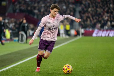 Mathias Jensen of Brentford crosses the ball during the Premier League match West Ham United vs Brentford at London Stadium, London, United Kingdom, 15th February 2025 clipart