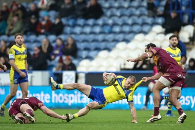 Matt Dufty, Huddersfield Giants takımının oyuncusu Leroy Cudjoe tarafından 16 Şubat 2025 'te John Smith' in Stadyumu 'nda oynanan Huddersfield Süper Lig 1. Raundu' nda Huddersfield Giants ve Warrington Wolves maçında yere serildi.