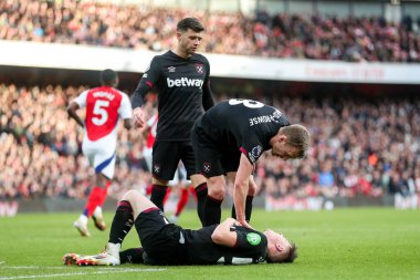 Ollie Scarles of West Ham United goes down with injury during the Premier League match Arsenal vs West Ham United at Emirates Stadium, London, United Kingdom, 22nd February 2025 clipart