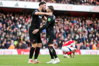 Maximilian Kilman celebrates with Aaron Cresswell of West Ham United after the teams victory following the Premier League match Arsenal vs West Ham United at Emirates Stadium, London, United Kingdom, 22nd February 2025 clipart