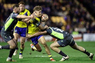 Warrington Wolves 'dan Arron Lindop, 21 Şubat 2025' te İngiltere 'nin Warrington Stadyumu' nda oynanan Betfred Süper Lig karşılaşmasında Katalan Ejderhaları 'ndan Paul Sguier tarafından yenildi.