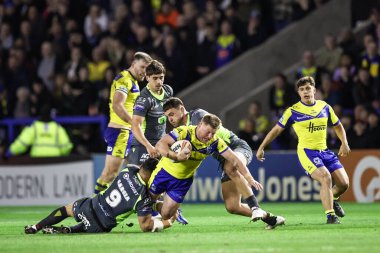 Warrington Wolves takımından Luke Yates, 21 Şubat 2025 'te Warrington, İngiltere' deki Luke Littler Stadyumu 'nda oynanan Betfred Süper Lig karşılaşmasında Katalan Ejderhaları' ndan Benjamin Garcia tarafından yenildi.