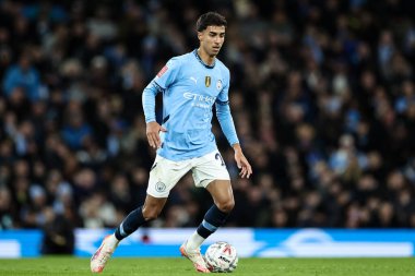 Vitor Reis of Manchester City with the ball during the Emirates FA Cup 5th Round match Manchester City vs Plymouth Argyle at Etihad Stadium, Manchester, United Kingdom, 1st March 2025 clipart