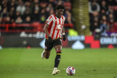 Sheffield United takımından Jesuran Rak-Sakyi, 11 Mart 2025 'te Sheffield Lane, İngiltere' de oynanan Bristol City maçında topu düşürüyor.