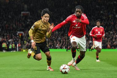 Manchester United 'dan Ayden Heaven ve Real Sociedad' dan Takefusa Kubo, UEFA Avrupa Ligi 'nde son 16 maç Manchester United' ın Real Sociedad 'a karşı Old Trafford, Manchester, Birleşik Krallık' ta 13 Mart 2025 'te oynadıkları maçta top için mücadele ettiler.