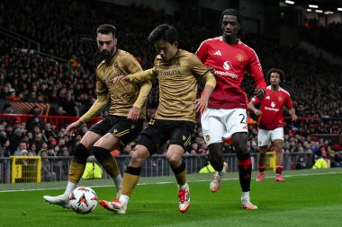 Real Sociedad 'dan Takefusa Kubo, UEFA Avrupa Ligi sırasında Manchester United' ın Real Sociedad 'a karşı oynadığı 13 Mart 2025 tarihinde Old Trafford, Manchester, İngiltere' de oynanan maçta topu Manchester Heaven of Manchester United 'dan aldı.