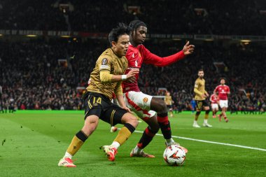 Manchester United 'dan Ayden Heaven ve Real Sociedad' dan Takefusa Kubo, UEFA Avrupa Ligi 'nde son 16 maç Manchester United' ın Real Sociedad 'a karşı Old Trafford, Manchester, Birleşik Krallık' ta 13 Mart 2025 'te oynadıkları maçta top için mücadele ettiler.