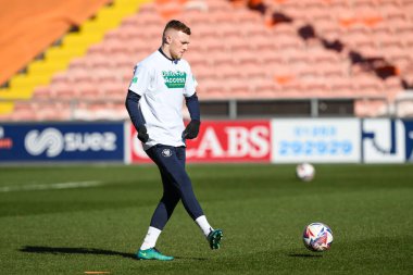 Blackpool 'dan Sonny Carey 15 Mart 2025' te Bloomfield Road, Blackpool 'da oynanan Blackpool-Leyton maçı öncesinde oynanan maç öncesi ısınma maçında giyilen tişörtlere erişim için birleşiyor.
